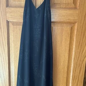 Younique Size L nwt black halter dresswith subtle sequence floral design.
